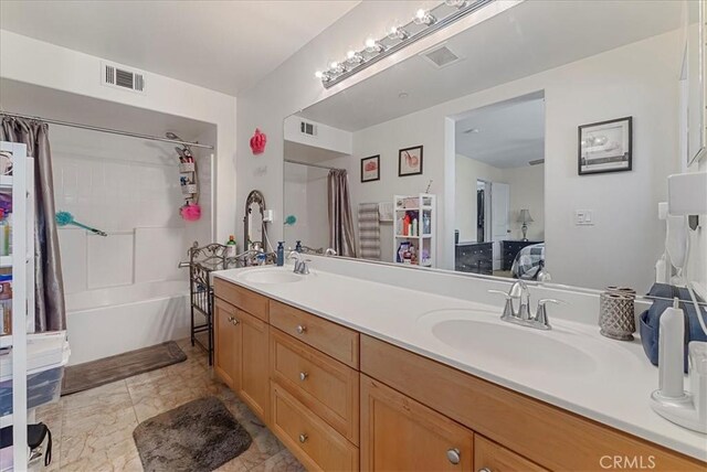 613 Flathead River St, Oxnard, CA 93036 - bathroom featuring double vanity and shower / tub combo