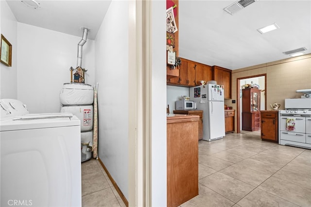 3095 Casitas Ave, Altadena, CA 91001 - washroom featuring water heater and light tile patterned floors