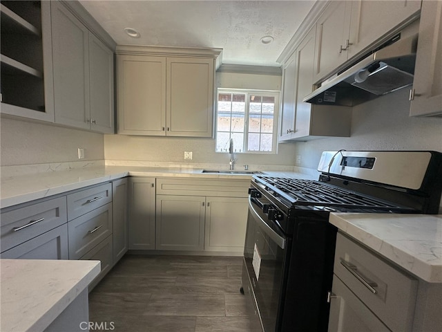 829 Foxworth Ave, La Puente, CA 91744 - kitchen with gas stove, under cabinet range hood, gray cabinets, light stone countertops, and dark wood-style flooring