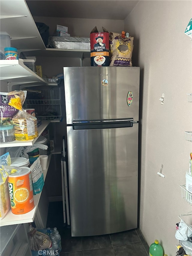 829 Foxworth Ave, La Puente, CA 91744 - kitchen featuring freestanding refrigerator and dark tile patterned flooring