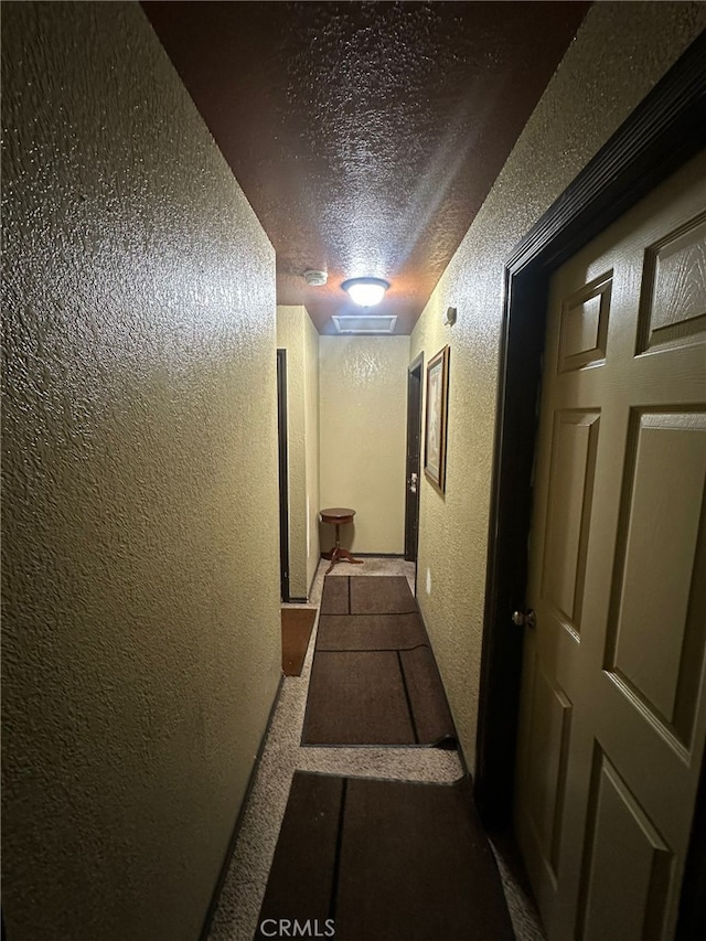 829 Foxworth Ave, La Puente, CA 91744 - corridor featuring a textured wall and a textured ceiling