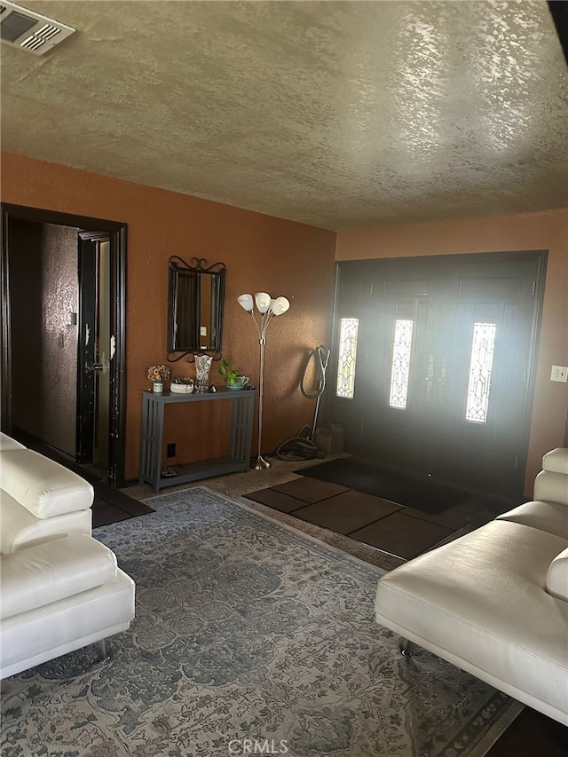 829 Foxworth Ave, La Puente, CA 91744 - carpeted living room with a textured ceiling