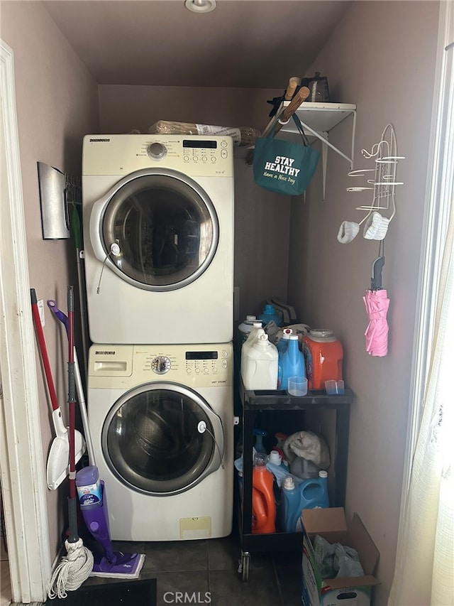 829 Foxworth Ave, La Puente, CA 91744 - laundry area with stacked washing machine and dryer and tile patterned flooring