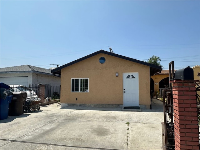 829 Foxworth Ave, La Puente, CA 91744 - view of front of home featuring stucco siding and a gate