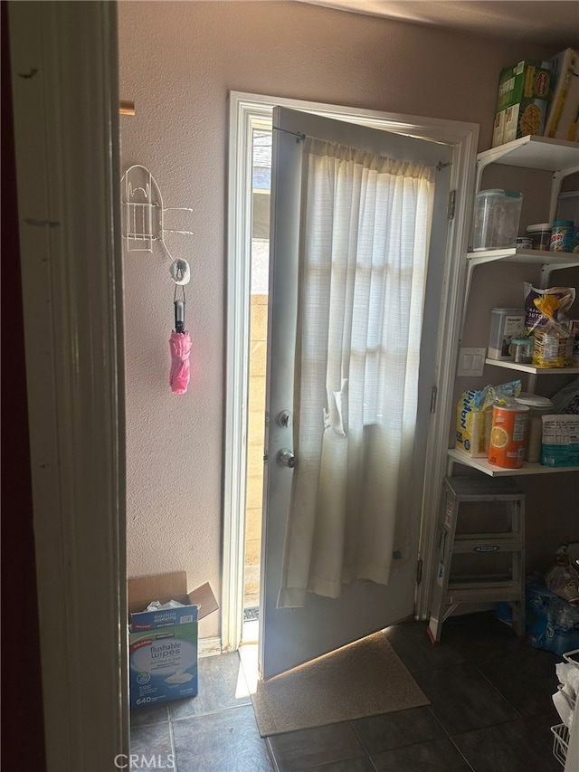 829 Foxworth Ave, La Puente, CA 91744 - entryway with a textured wall and tile patterned floors