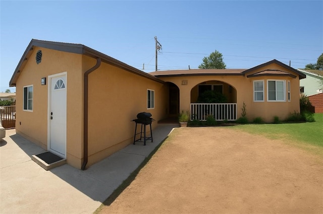 829 Foxworth Ave, La Puente, CA 91744 - view of front of house with stucco siding and a porch