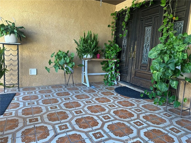 829 Foxworth Ave, La Puente, CA 91744 - doorway to property with stucco siding and french doors
