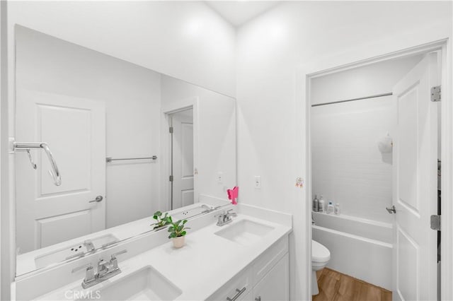 16526 Trailblazer Ave, Chino, CA 91708 - bathroom featuring double vanity, wood finished floors, and shower / washtub combination