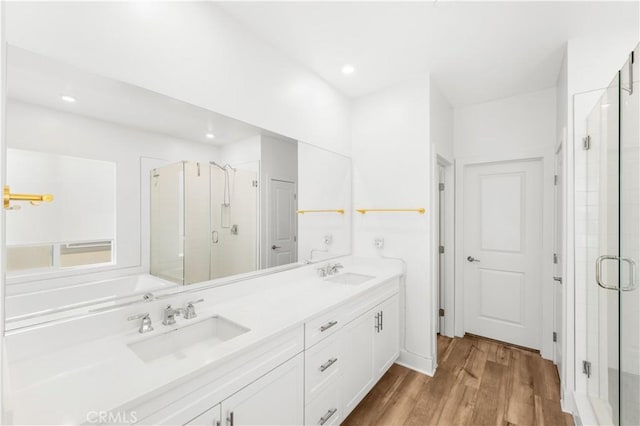 16526 Trailblazer Ave, Chino, CA 91708 - full bath featuring a shower stall, double vanity, wood finished floors, and recessed lighting