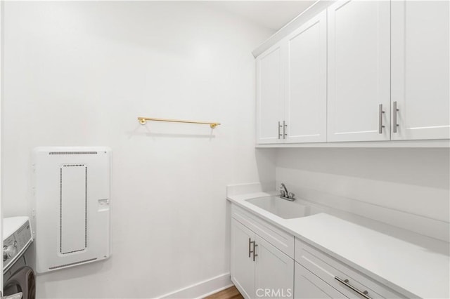 16526 Trailblazer Ave, Chino, CA 91708 - laundry room with cabinet space, heating unit, and washer / clothes dryer