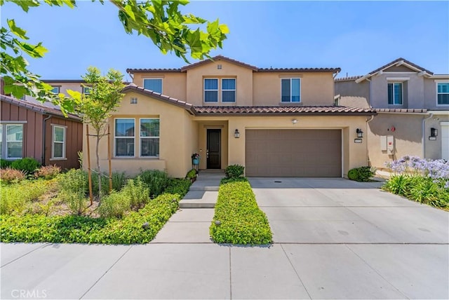 16526 Trailblazer Ave, Chino, CA 91708 - mediterranean / spanish-style house with stucco siding, concrete driveway, a garage, and a tile roof