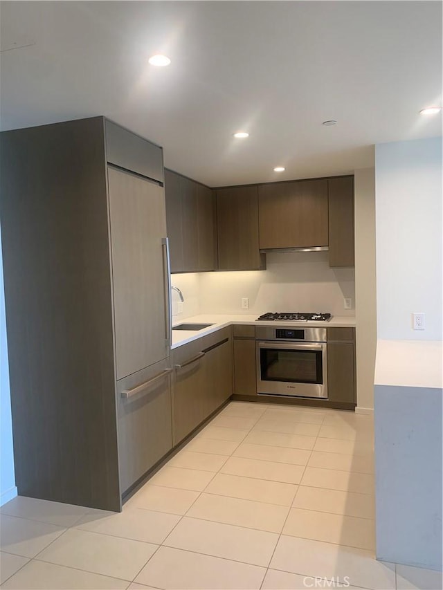889 Francisco St Unit 2601, Los Angeles, CA 90017 - kitchen with appliances with stainless steel finishes, a sink, light countertops, modern cabinets, and recessed lighting