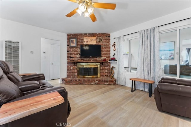 433 E Mason St, Azusa, CA 91702 - living room featuring a heating unit, a ceiling fan, wood finished floors, and a fireplace