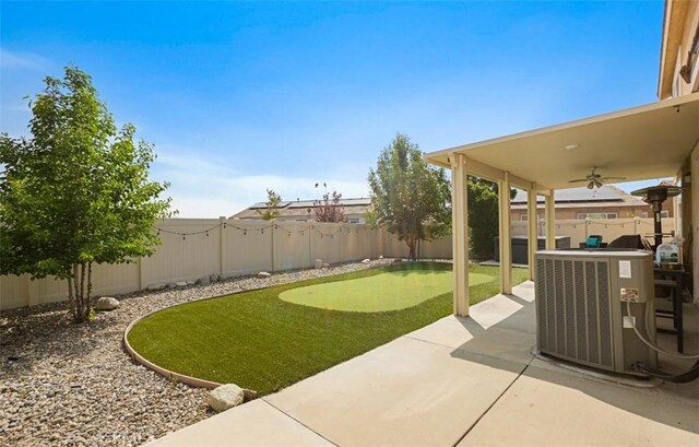 17995 Lacebark Ct, San Bernardino, CA 92407 - fenced backyard with an area to practice putting, ceiling fan, and a patio