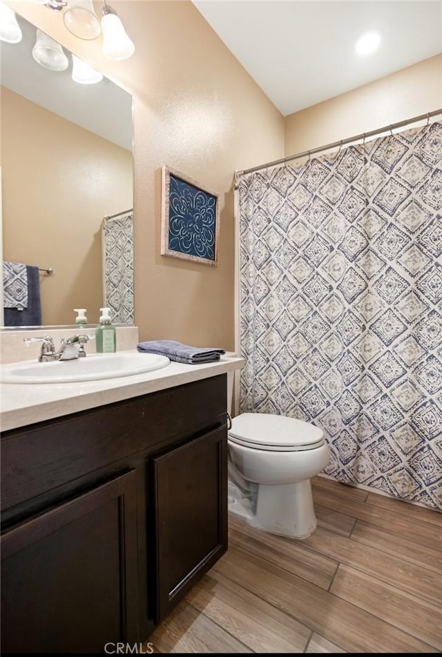 17995 Lacebark Ct, San Bernardino, CA 92407 - bathroom featuring vanity and wood finished floors