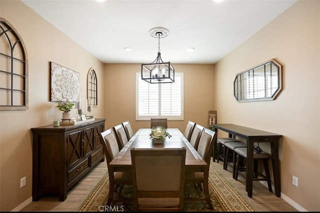 17995 Lacebark Ct, San Bernardino, CA 92407 - dining space with light wood-style floors, a chandelier, and recessed lighting