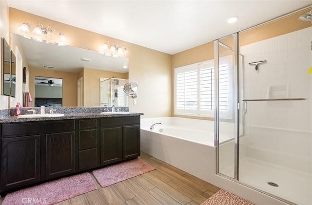 17995 Lacebark Ct, San Bernardino, CA 92407 - full bath with wood finished floors, a shower stall, and double vanity