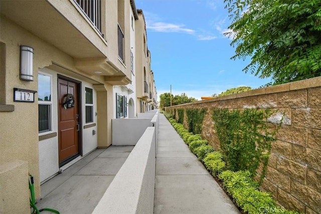2750 182nd St Unit 112, Torrance, CA 90504 - view of property exterior with stucco siding and a balcony