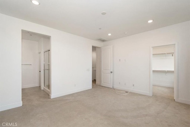 2750 182nd St Unit 112, Torrance, CA 90504 - unfurnished bedroom featuring a spacious closet, recessed lighting, light carpet, baseboards, and a closet