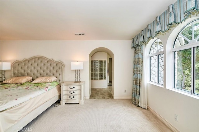 1089 Village Dr, Chino Hills, CA 91709 - bedroom with arched walkways, multiple windows, light carpet, and baseboards