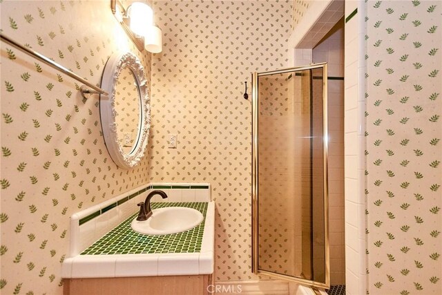 1089 Village Dr, Chino Hills, CA 91709 - full bath featuring wallpapered walls, a stall shower, and vanity