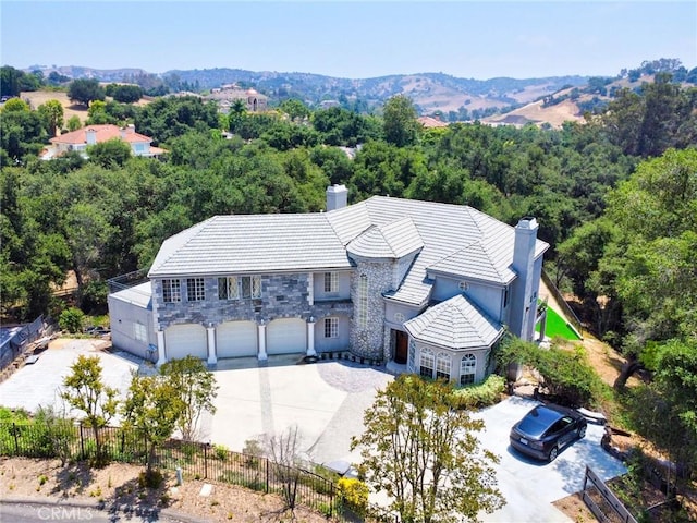 1089 Village Dr, Chino Hills, CA 91709 - aerial view of property and surrounding area featuring a mountain backdrop and a forest