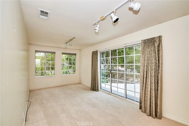 1089 Village Dr, Chino Hills, CA 91709 - carpeted empty room featuring rail lighting, baseboards, and healthy amount of natural light