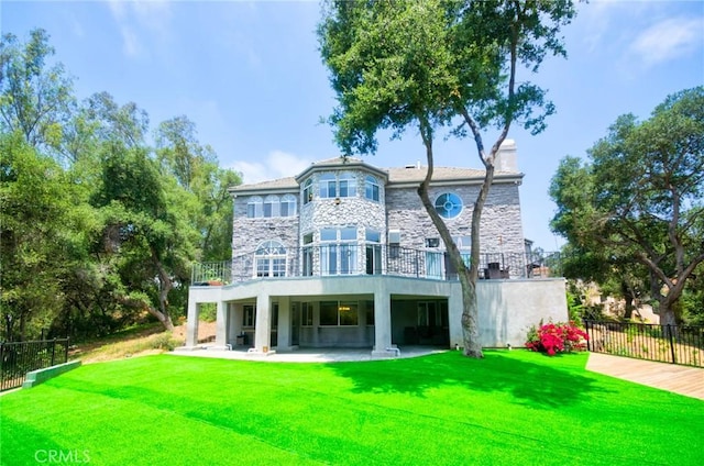 1089 Village Dr, Chino Hills, CA 91709 - back of house featuring a patio, stone siding, and a balcony