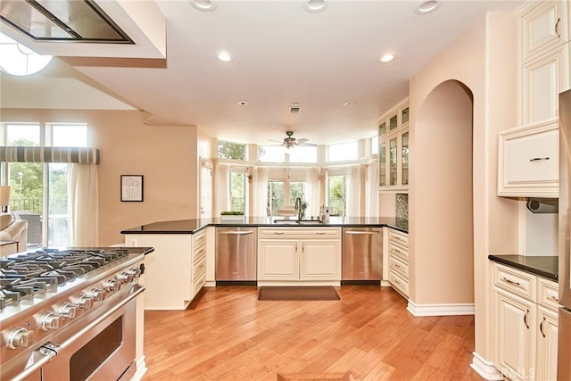 1089 Village Dr, Chino Hills, CA 91709 - kitchen featuring stainless steel appliances, a ceiling fan, dark countertops, light wood finished floors, and recessed lighting