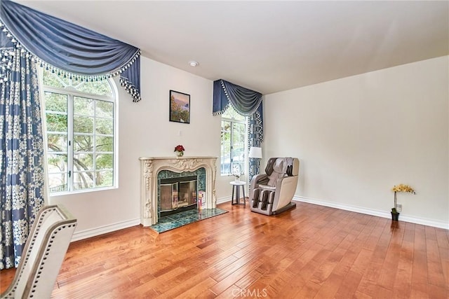 1089 Village Dr, Chino Hills, CA 91709 - living area with wood-type flooring, baseboards, and a high end fireplace