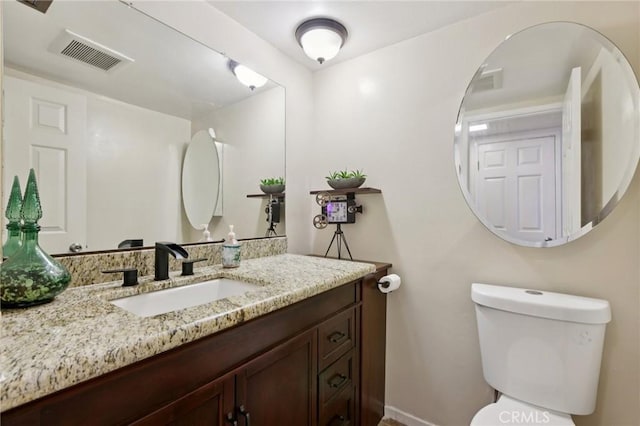 10161 Larwin Ave Unit 3, Chatsworth, CA 91311 - half bathroom featuring vanity, toilet, and baseboards