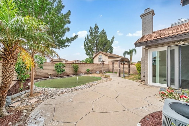 10991 Countryview Dr, Rancho Cucamonga, CA 91730 - fenced backyard with a putting green, central air condition unit, and a patio