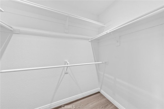 10991 Countryview Dr, Rancho Cucamonga, CA 91730 - walk in closet featuring wood finished floors
