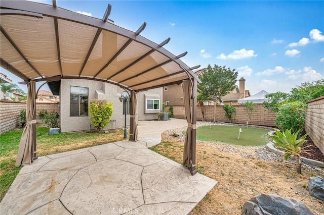 10991 Countryview Dr, Rancho Cucamonga, CA 91730 - fenced backyard with an area to practice putting, a patio, and central AC unit