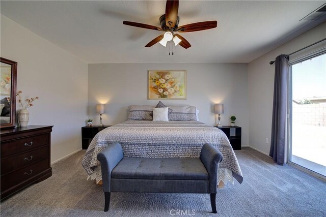 47734 Mirage Way, Indio, CA 92201 - carpeted bedroom with access to outside and ceiling fan