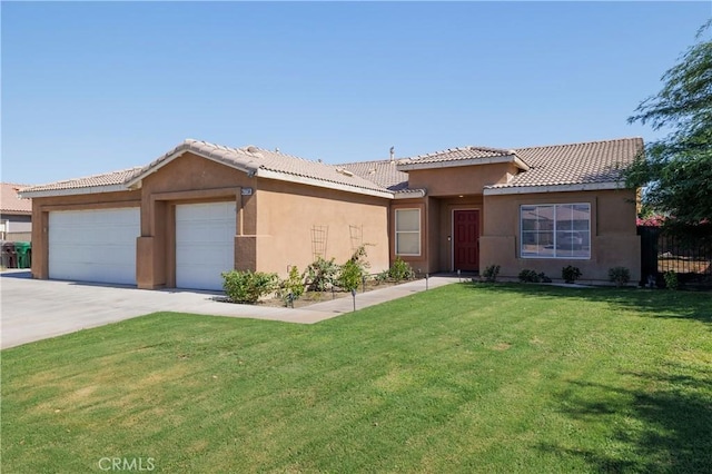 47734 Mirage Way, Indio, CA 92201 - single story home with a garage, stucco siding, concrete driveway, and a tiled roof