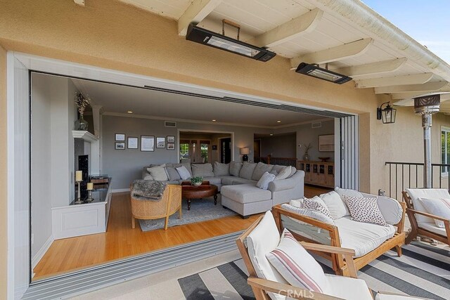 1609 Via Montemar, Palos Verdes Estates, CA 90274 - living area with beam ceiling, healthy amount of natural light, wood finished floors, and crown molding