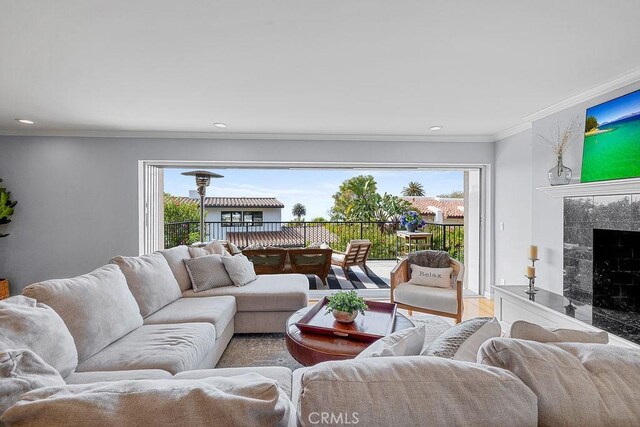 1609 Via Montemar, Palos Verdes Estates, CA 90274 - living area featuring crown molding, a fireplace, wood finished floors, and recessed lighting