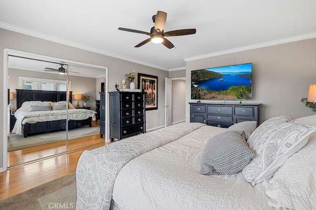 1609 Via Montemar, Palos Verdes Estates, CA 90274 - bedroom featuring wood finished floors, ornamental molding, a ceiling fan, and a closet