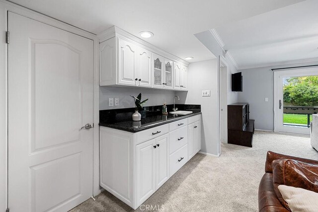 1609 Via Montemar, Palos Verdes Estates, CA 90274 - kitchen featuring light carpet, white cabinets, glass insert cabinets, crown molding, and recessed lighting