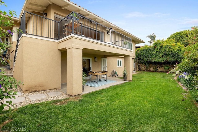 1609 Via Montemar, Palos Verdes Estates, CA 90274 - rear view of property with a balcony, stucco siding, a yard, and a patio area