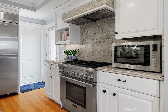 1609 Via Montemar, Palos Verdes Estates, CA 90274 - kitchen featuring high quality appliances, custom range hood, white cabinets, decorative backsplash, and light wood-style flooring