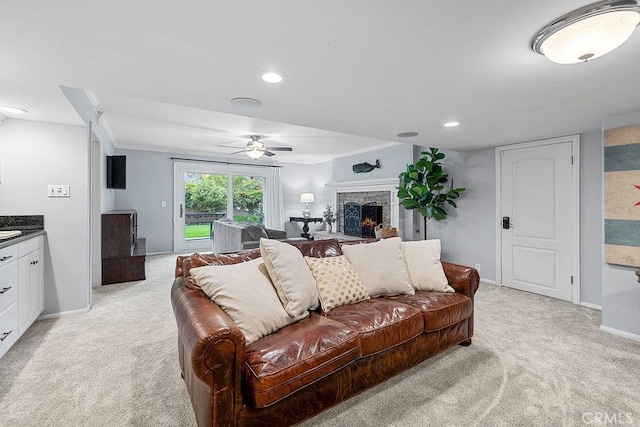 1609 Via Montemar, Palos Verdes Estates, CA 90274 - living room with a ceiling fan, light colored carpet, a stone fireplace, ornamental molding, and recessed lighting