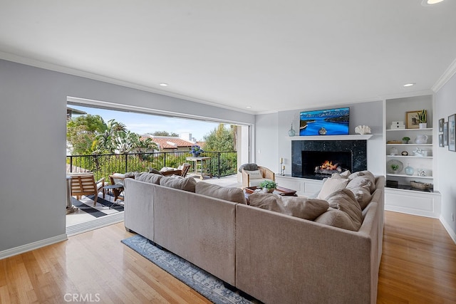 1609 Via Montemar, Palos Verdes Estates, CA 90274 - living area with ornamental molding, a premium fireplace, light wood-style flooring, built in shelves, and recessed lighting