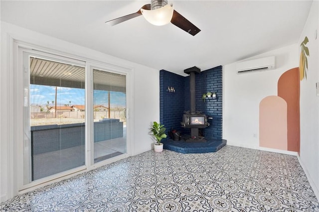 72726 Desert Trail Dr Unit 29, Palms, CA 92277 - unfurnished living room with a wall mounted AC, a ceiling fan, a wood stove, and lofted ceiling