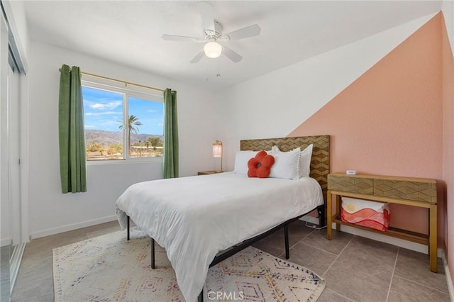 72726 Desert Trail Dr Unit 29, Palms, CA 92277 - bedroom featuring ceiling fan, tile patterned flooring, and baseboards