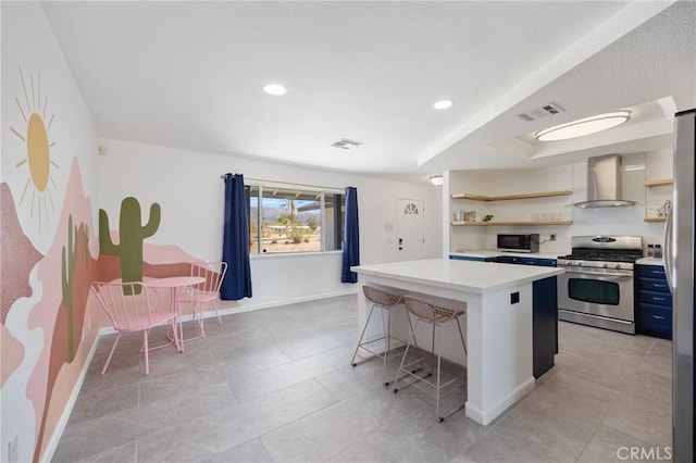 72726 Desert Trail Dr Unit 29, Palms, CA 92277 - kitchen with appliances with stainless steel finishes, wall chimney range hood, open shelves, a center island, and recessed lighting