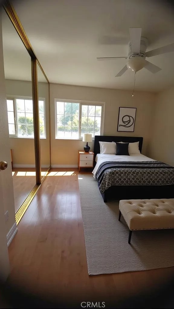 1717 Morning Sun Ave, Walnut, CA 91789 - bedroom featuring multiple windows, wood finished floors, and ceiling fan