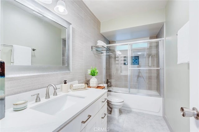 1717 Morning Sun Ave, Walnut, CA 91789 - bathroom with vanity, combined bath / shower with glass door, tile patterned floors, and tile walls