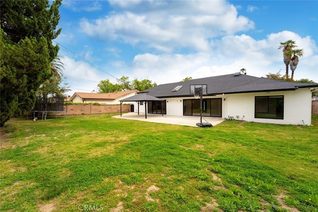 4801 Heaven Ave, Woodland Hills, CA 91364 - rear view of property featuring a trampoline, a gazebo, a patio, and stucco siding